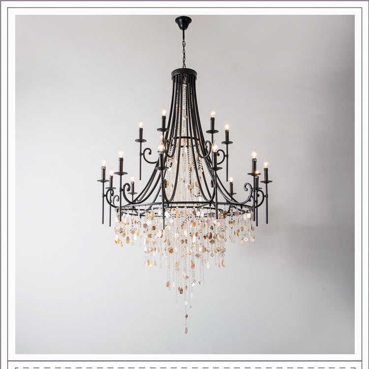 Clérachic Trove in black at a larger size, a tall tapered body opening into two lit tiers of candle arms.