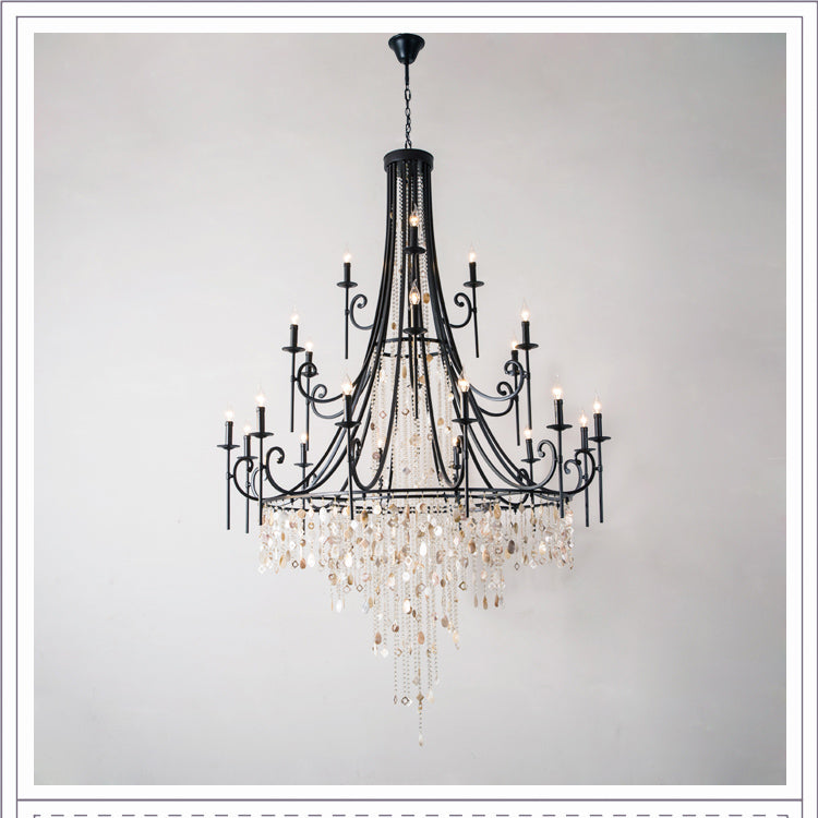 Clérachic Trove in black across three tiers, its widest arms reaching out over the crystal-and-stone cascade.