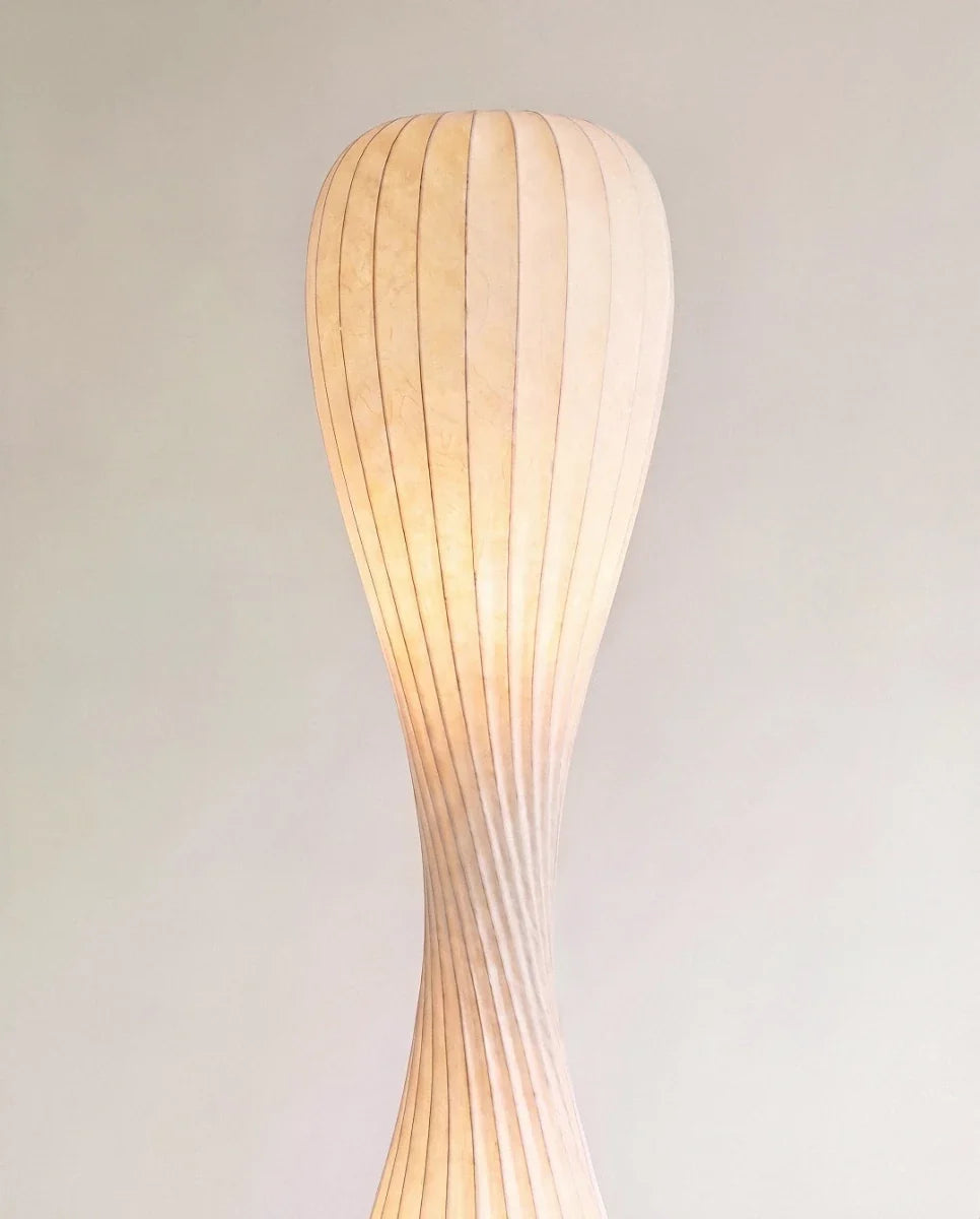 Clérachic close-up of the lit upper shade, showing fine vertical ribs and a soft glowing paper-like texture.