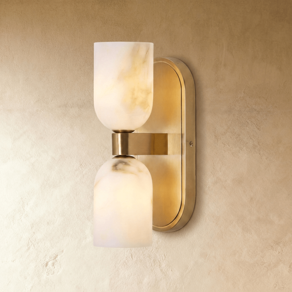 Clérachic dual-shade wall sconce unlit on a warm plaster wall, gold-brown veining running through its wide-topped upper shade.