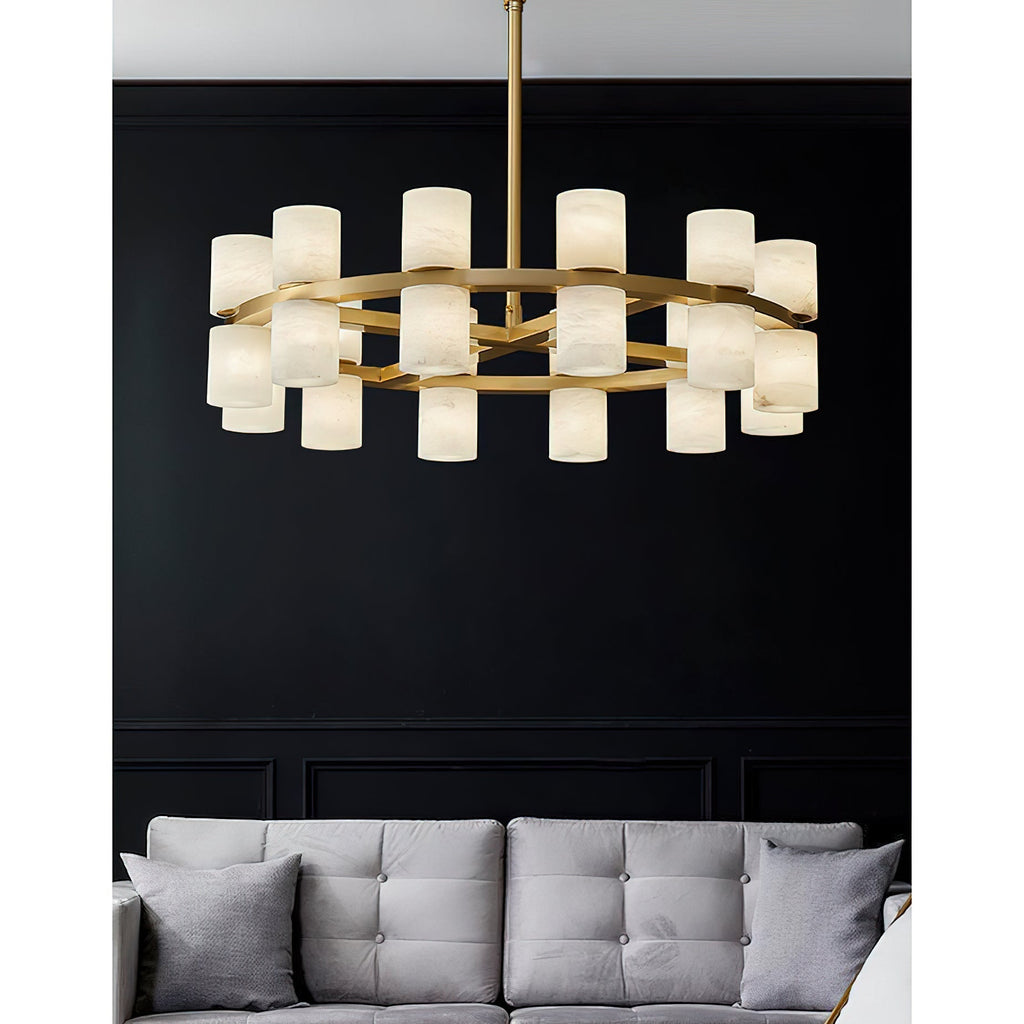 Clérachic Two-Ring Chandelier against a black panelled wall, its pale shades and brass rings lifted by the dark backdrop.