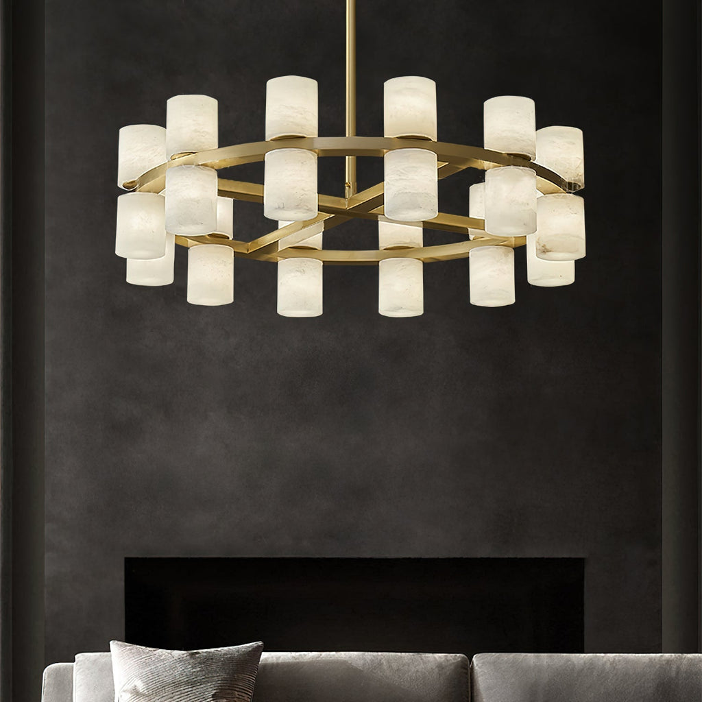 The Clérachic Two-Ring Chandelier above a fireplace wall in charcoal plaster, its alabaster shades glowing warm.