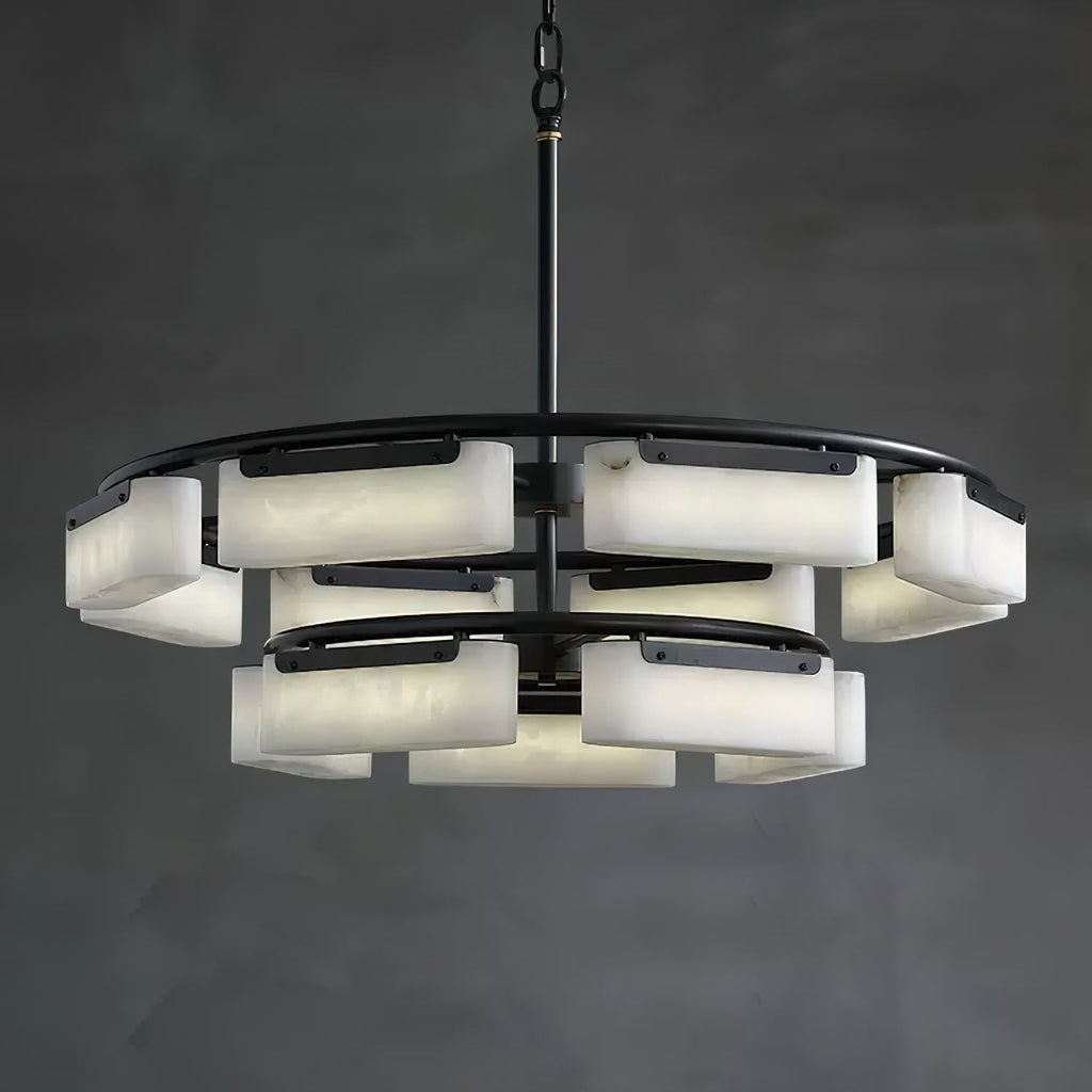 The Clérachic Two-Tier Alabaster Ring Chandelier lit against a dark charcoal wall, twelve alabaster shades glowing softly.