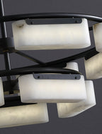 Close detail of the Clérachic alabaster ring chandelier with light passing through the veined stone shades on both tiers.