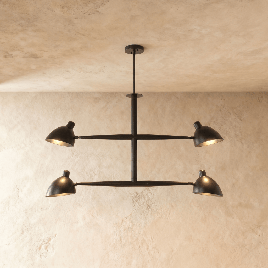 Clérachic chandelier in matte black, four cone shades on a crossbar frame beneath a plaster ceiling.