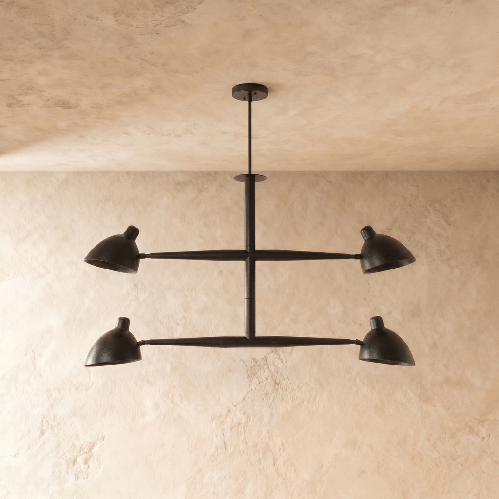 Clérachic chandelier in matte black shown from another angle, its crossbar arms catching soft light.