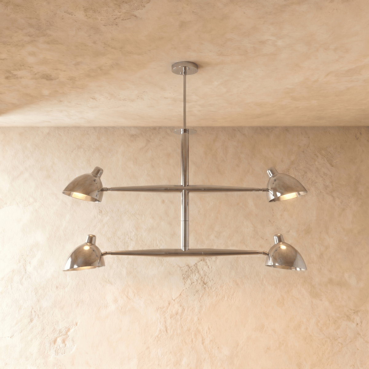 Clérachic chandelier in chrome, four cone shades on a crossbar frame beneath a plaster ceiling.