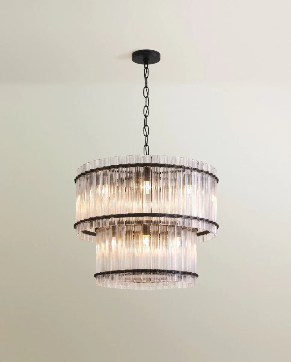 Clérachic two-tier chandelier with a matte black frame, chain and canopy, wrapped in fluted clear glass rods.