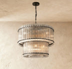 Clérachic two-tier chandelier in matte black with fluted clear glass rods and round black studs, hung on a black chain.