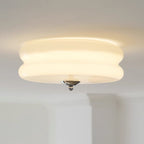 Lit close-up of the Clérachic two-tier flush mount ceiling light, its opal glass glowing evenly with a chrome finial.
