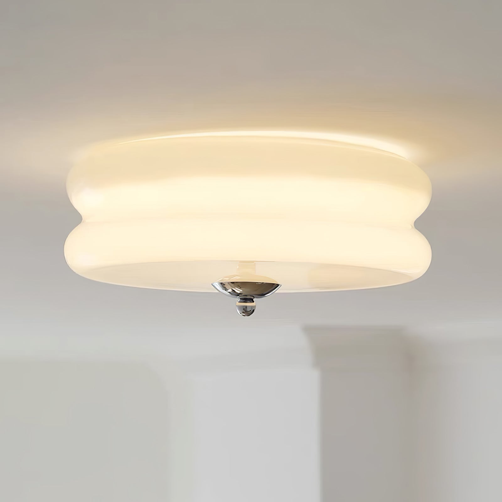 Lit close-up of the Clérachic two-tier flush mount ceiling light, its opal glass glowing evenly with a chrome finial.