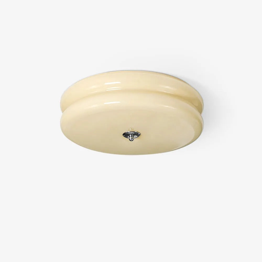 Clérachic two-tier flush mount ceiling light in beige glass on a plain white background, chrome finial underneath.