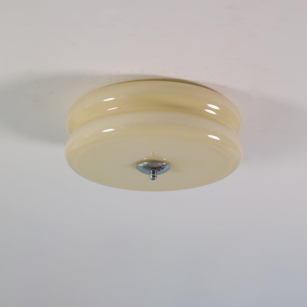 Cream glass Clérachic two-tier flush mount ceiling light fitted flat to a plaster ceiling, chrome finial pointing down.