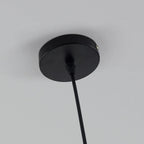 Close-up of the black ceiling canopy and cord on the Clérachic two-tone dome pendant, mounted on a plain wall.