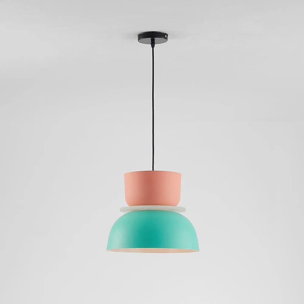 Full studio shot of the Clérachic two-tone dome pendant in pink and mint, hung from its black ceiling canopy.
