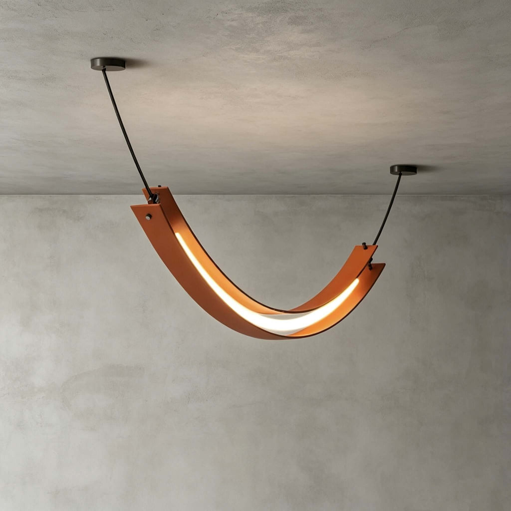 Seen from below against a concrete-look ceiling, this Clérachic U-shaped pendant shows its curved terracotta body and lit strip.