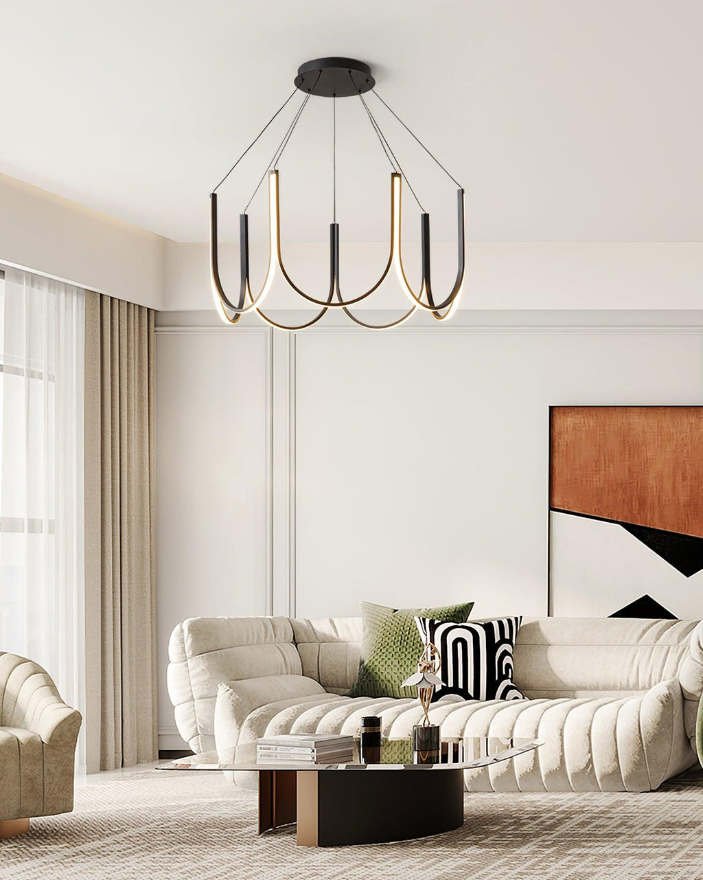Clérachic looped arm pendant over a curved cream sofa and low timber coffee table.