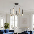 Clérachic looped arm pendant in a Parisian salon with blue sofas and tall windows.