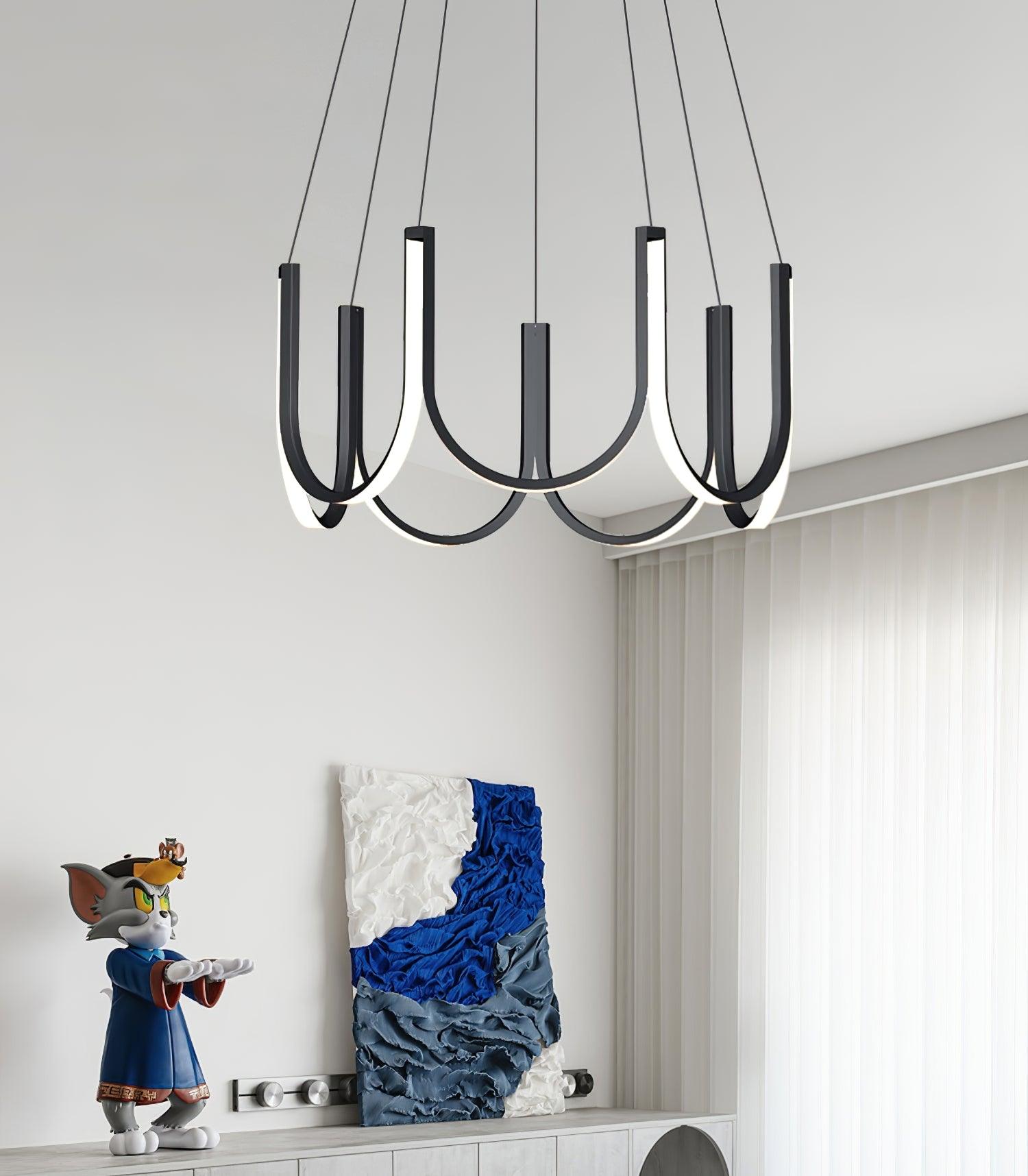 Clérachic looped arm pendant above a console holding a figurine and blue abstract canvas.