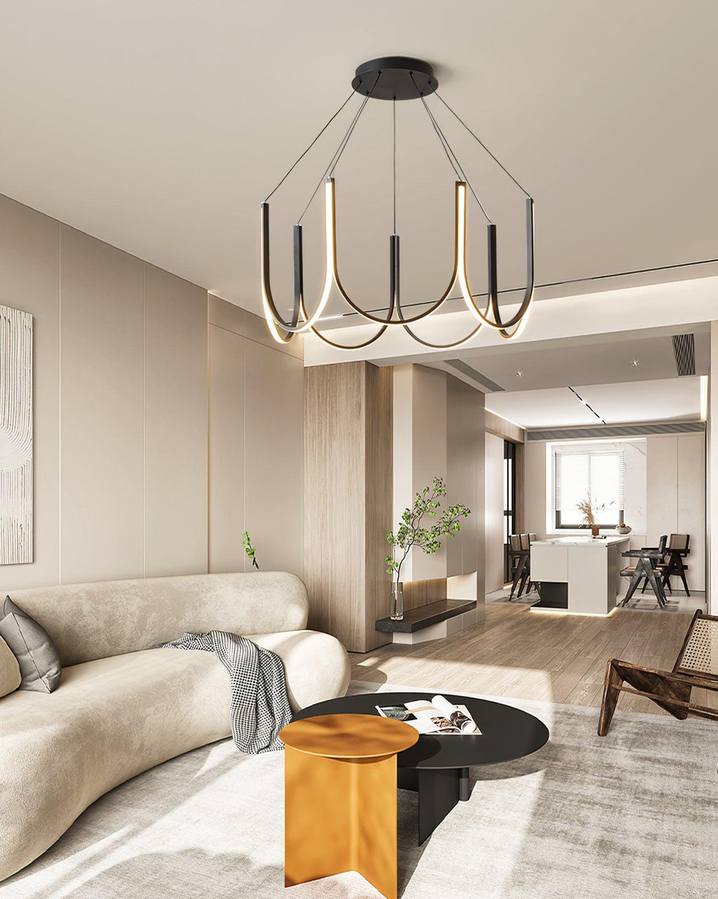 The Clérachic looped arm pendant over an open-plan lounge with a curved sofa and orange stool.