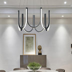 Clérachic looped arm pendant over a dining table set below framed art and a bust.