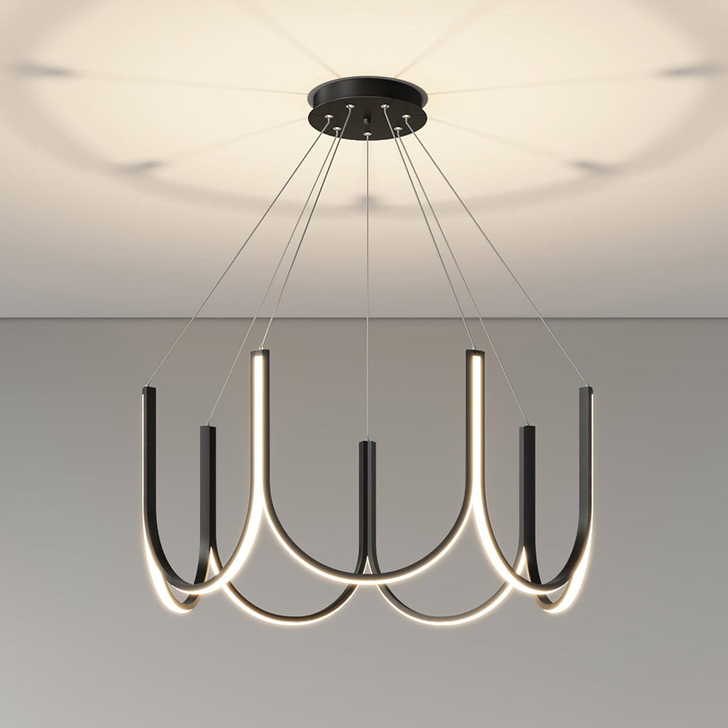 Clérachic looped arm pendant lit close under the ceiling, soft pools of light above.