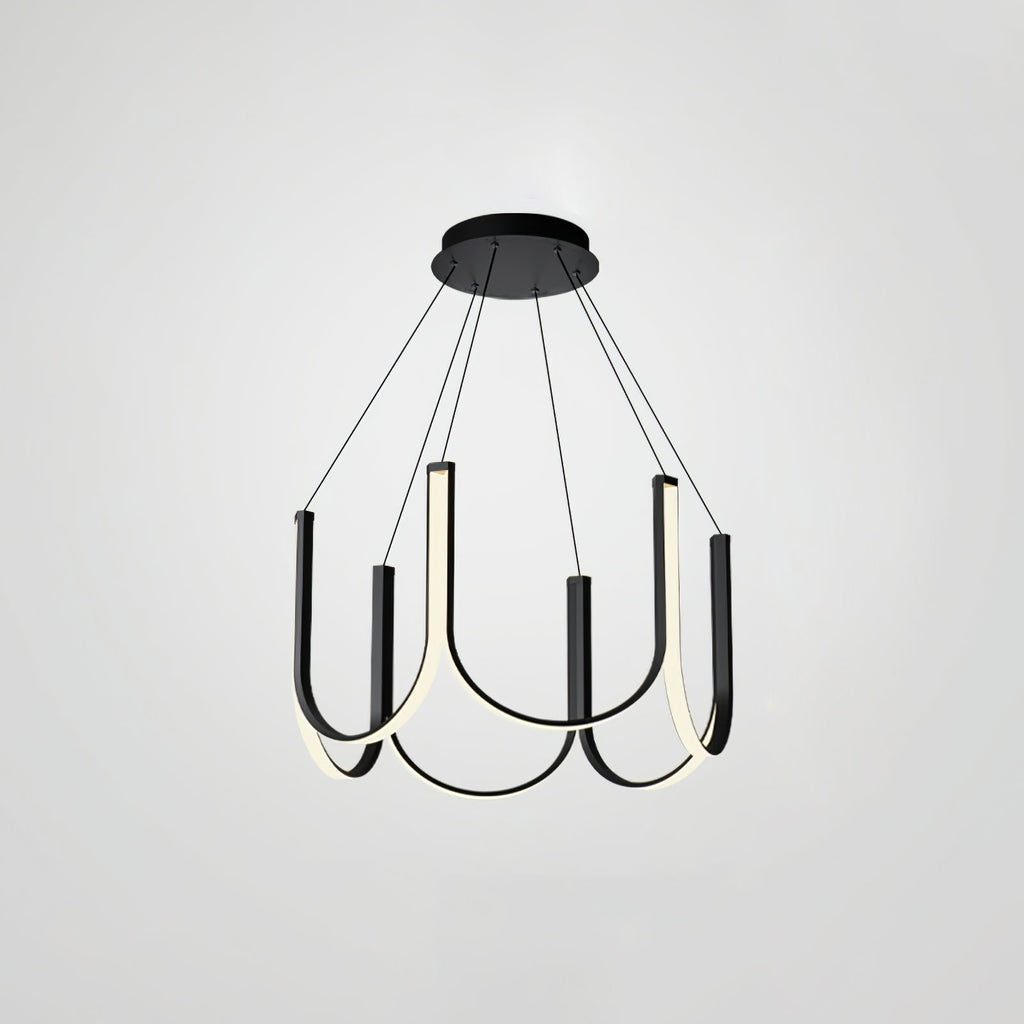 Clérachic looped arm pendant on grey, lit and angled to show the black outer faces.