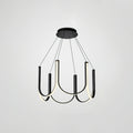 Clérachic looped arm pendant on grey, lit and angled to show the black outer faces.