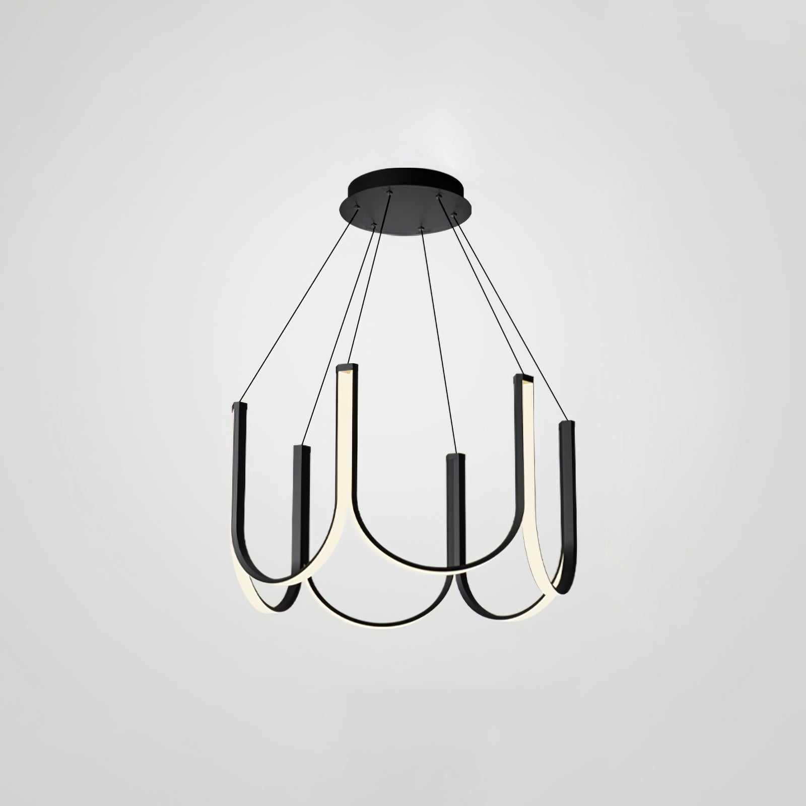 Clérachic looped arm pendant on grey, lit and angled to show the black outer faces.