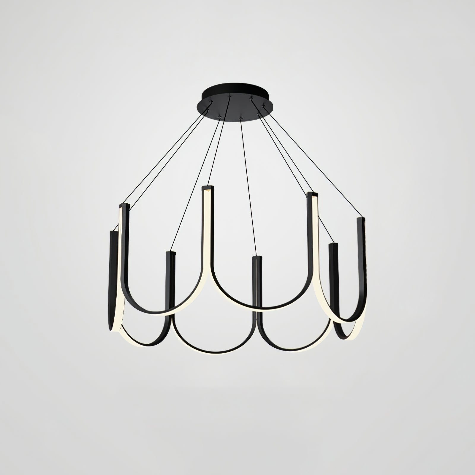 Clérachic looped arm pendant on grey, three-quarter view with the canopy in frame.