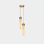 The Clérachic two-head canopy photographed straight on, its short alabaster tubes set close together on slim brass cords.