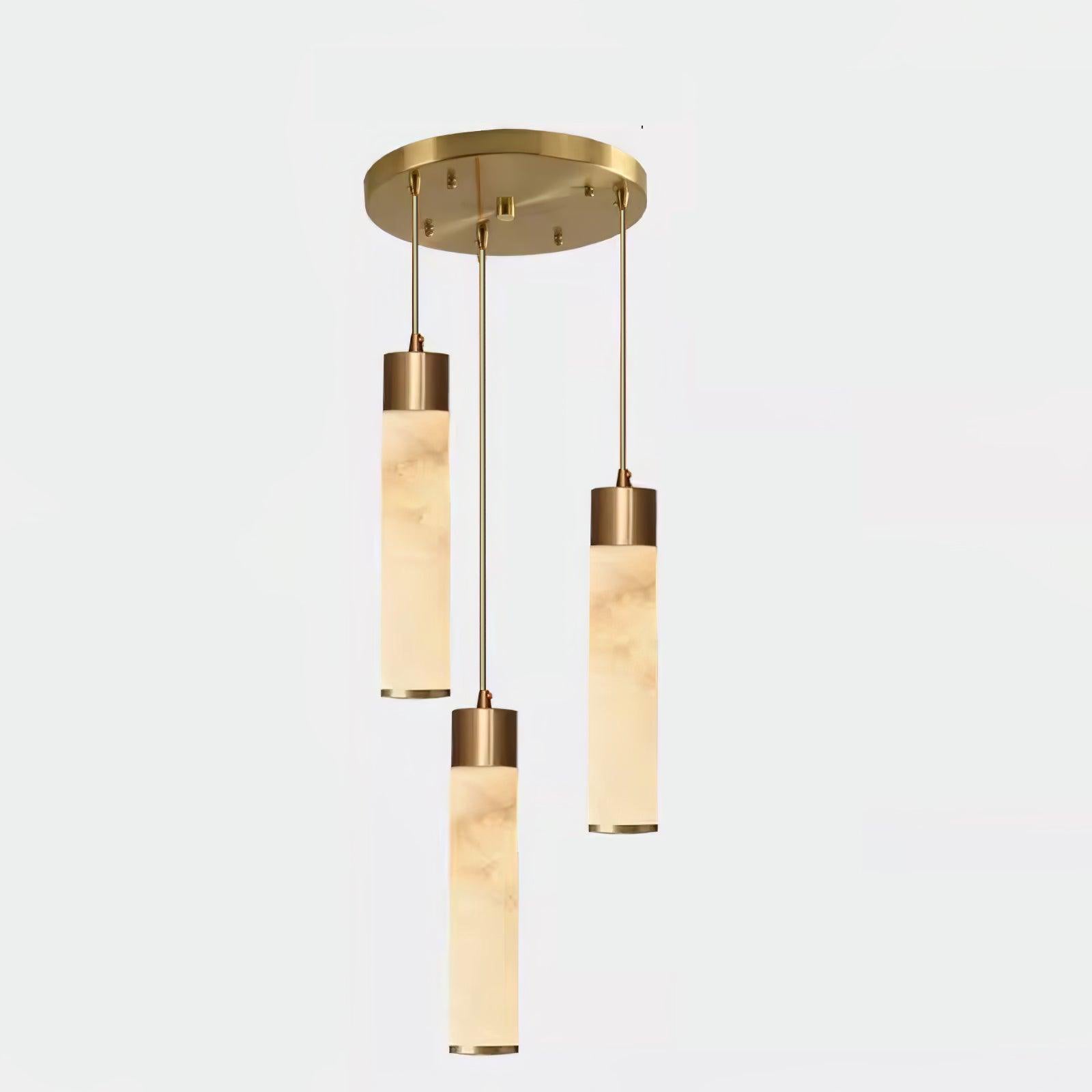 Clérachic spreads the three-head round canopy wider here, long cords carrying honey-toned alabaster tubes.