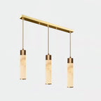 Clérachic spaces the three drops evenly along the brass bar, seen here from the opposite side.