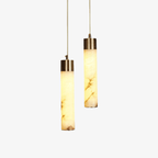 The Clérachic cylinders lit from within, glowing amber and revealing the grain hidden inside the stone.