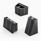 Clérachic black solar wall lights shown in three forms: a boxy one, a wide multi-head panel and a tilted wedge.