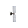 Side profile of the Clérachic alabaster wall sconce on white, showing how little the brass arm projects from the round wall plate.