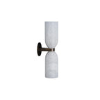 Side profile of the Clérachic alabaster wall sconce on white, showing how little the brass arm projects from the round wall plate.