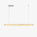 Clérachic Velmore linear pendant on white, a slim alabaster bar suspended on two fine cables.