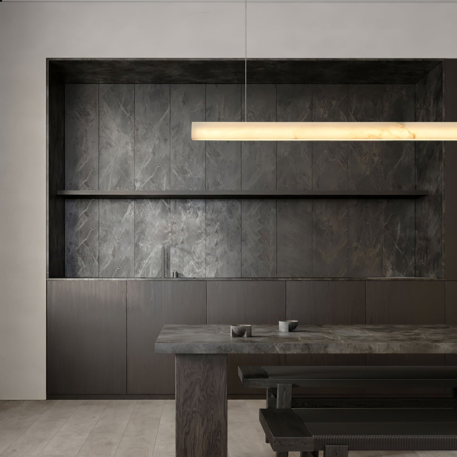 Clérachic Velmore pendant lighting a grey stone kitchen with a long central island.