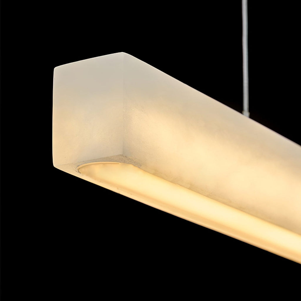 End-on detail of the Clérachic Velmore pendant showing its softly rounded alabaster profile.