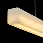 End-on detail of the Clérachic Velmore pendant showing its softly rounded alabaster profile.