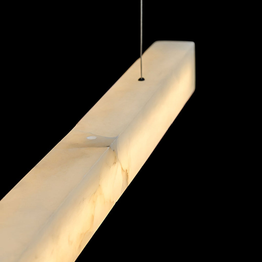 The Clérachic Velmore pendant photographed on black, lit evenly along its full length.