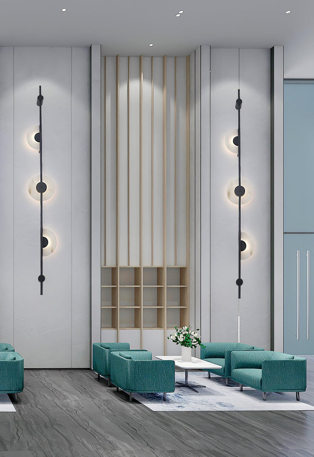 A pair of black three-disc Clérachic sconces on a tall pale wall flanking slatted wood panelling, above teal armchairs in a lobby.