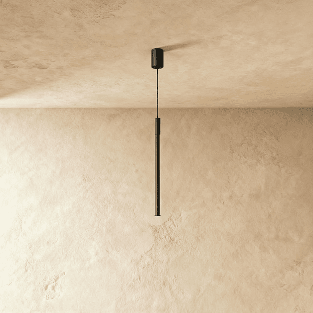 Side view of the Clérachic vertical black pendant shows its ribbed metal rod suspended on a fine black cable.