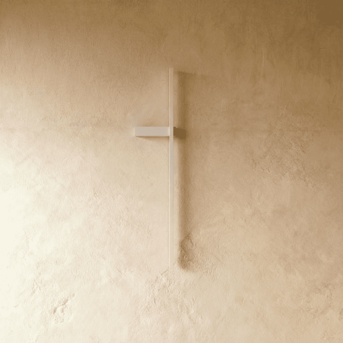 Clérachic slim white vertical light bar shown switched off on a limewash wall, with a short horizontal bracket.