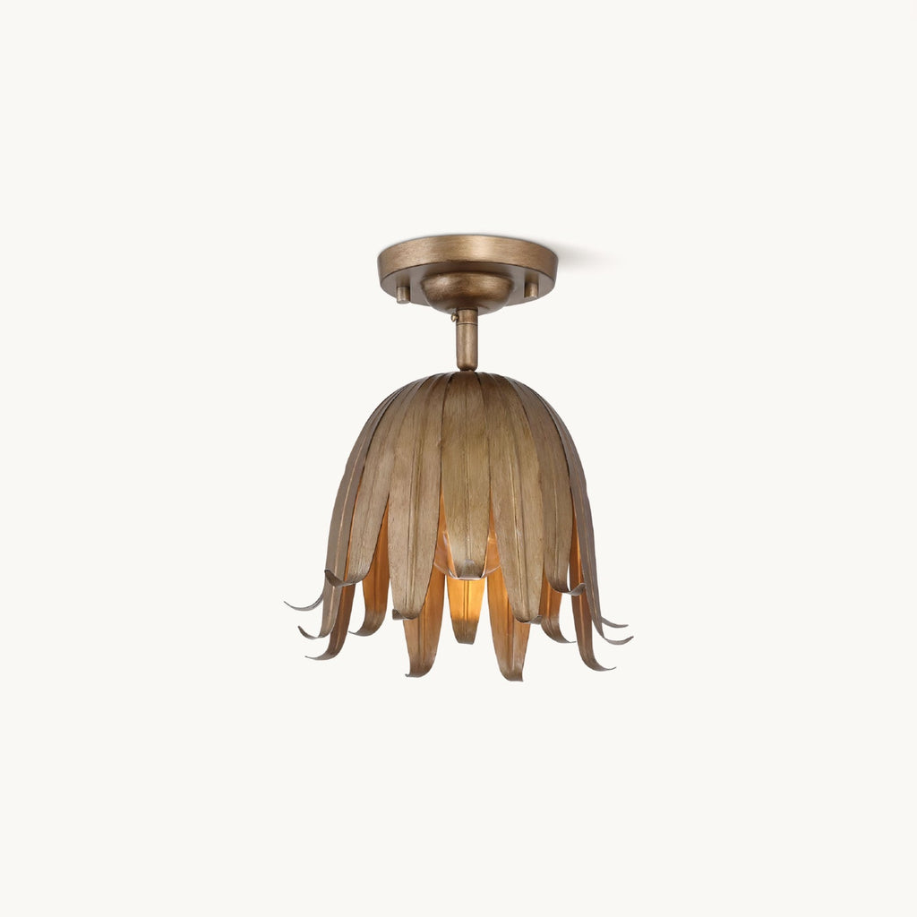 Clérachic flush-mount ceiling light in vintage gold, a bell of slim curled petals under a round canopy, on a plain white backdrop.