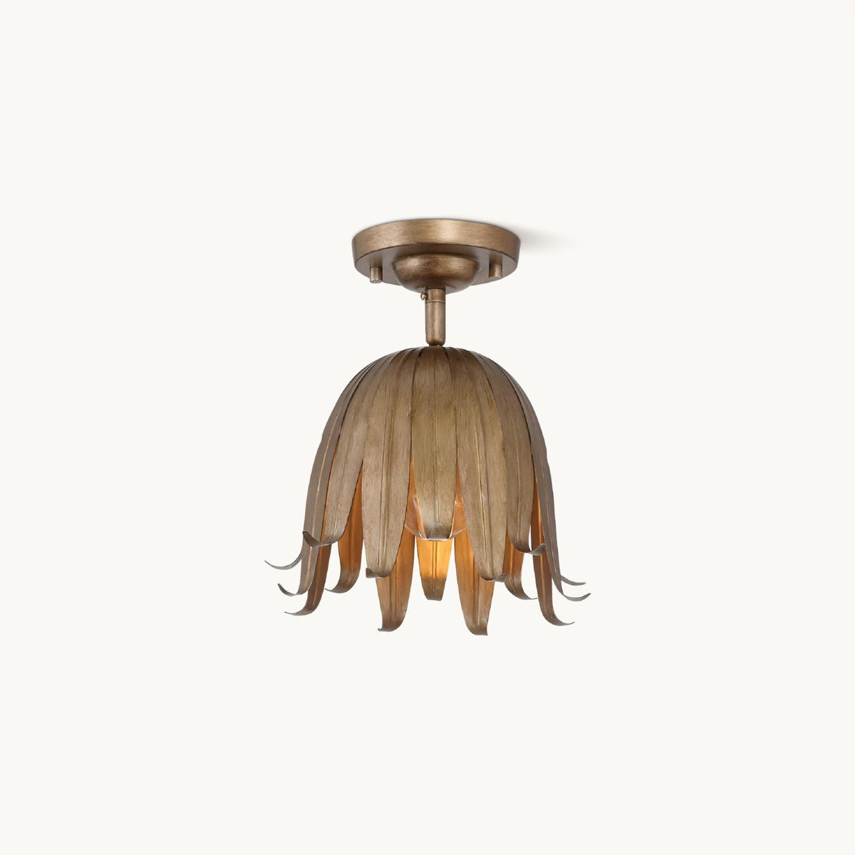 Clérachic flush-mount ceiling light in vintage gold, a bell of slim curled petals under a round canopy, on a plain white backdrop.