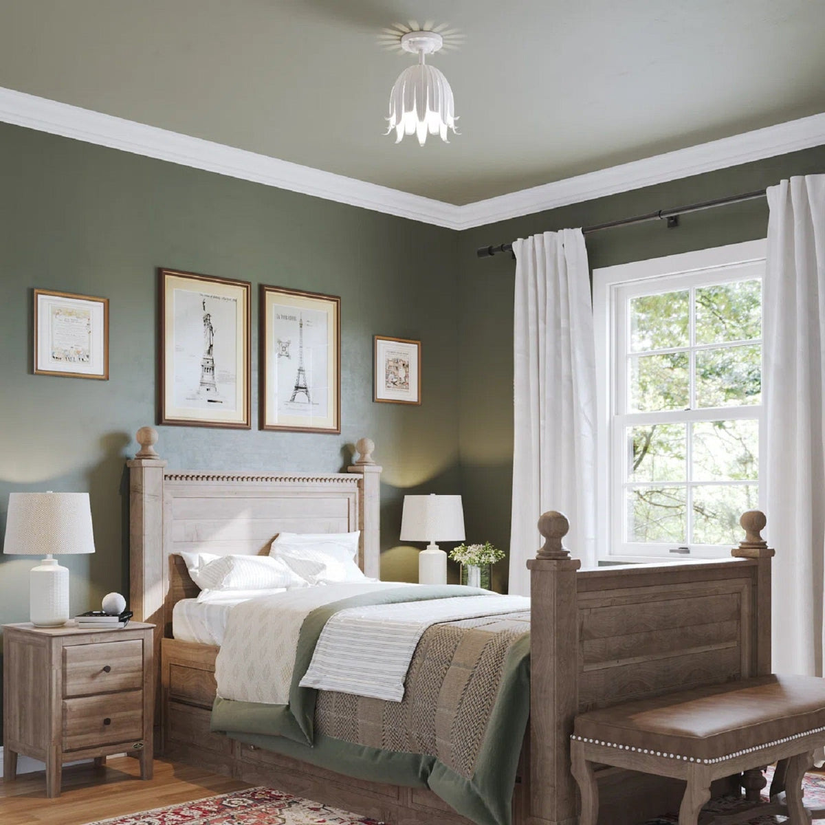 A small white Clérachic petal ceiling light in a green-walled bedroom, with a wooden bed, bedside lamps and framed prints.