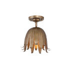 Vintage gold Clérachic ceiling light on a plain white background, its layered metal petals curling out below a round canopy.