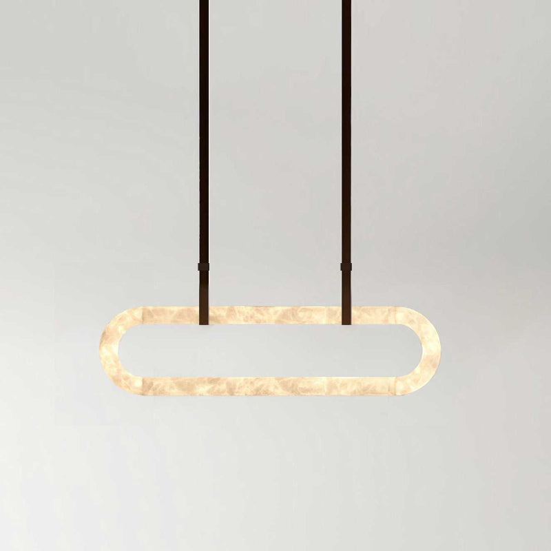 The Clérachic Vista in its wider format, dark strap hangers holding a lit alabaster ring against pale grey.
